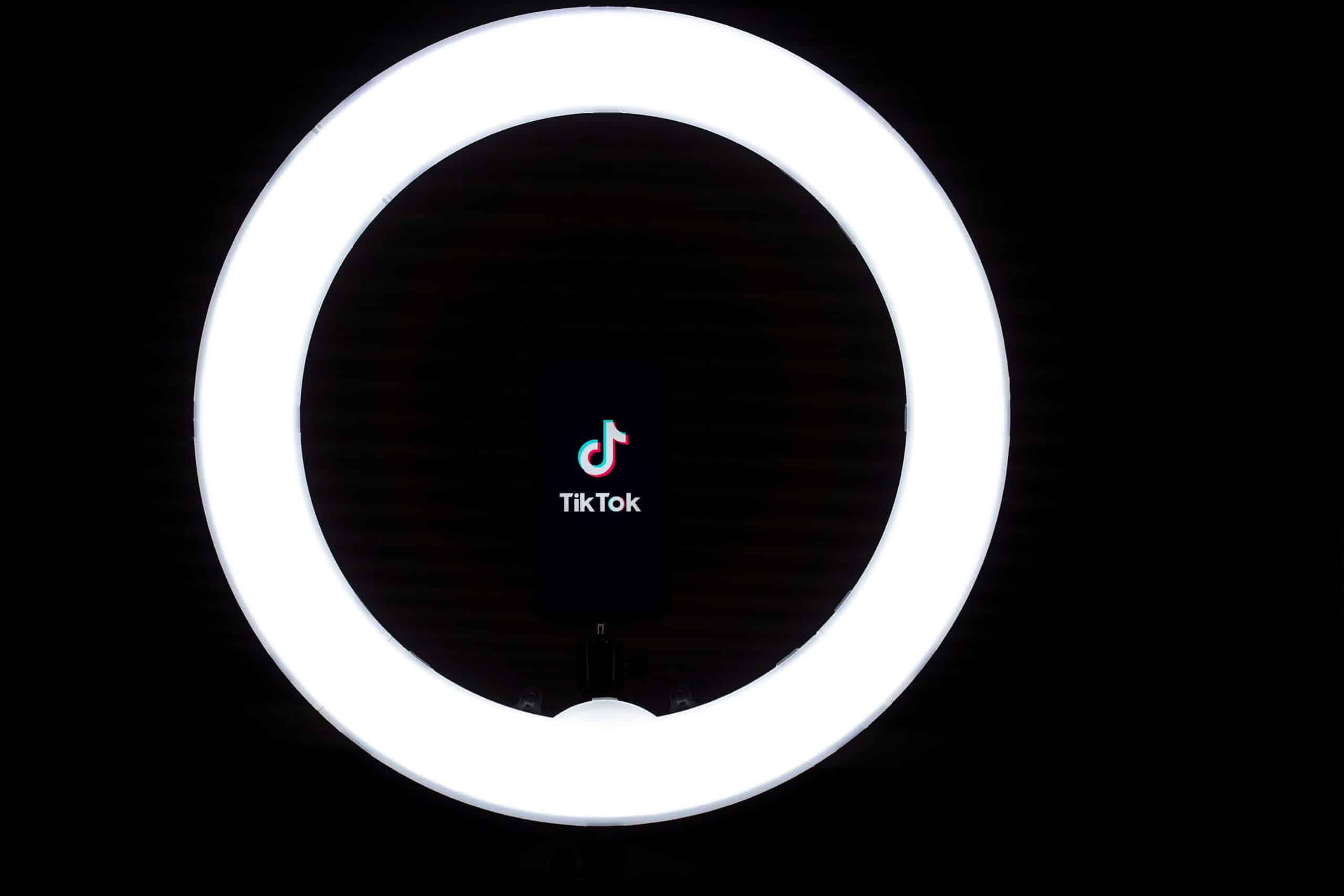 tiktok logo inside a ring light for a creator to record a video